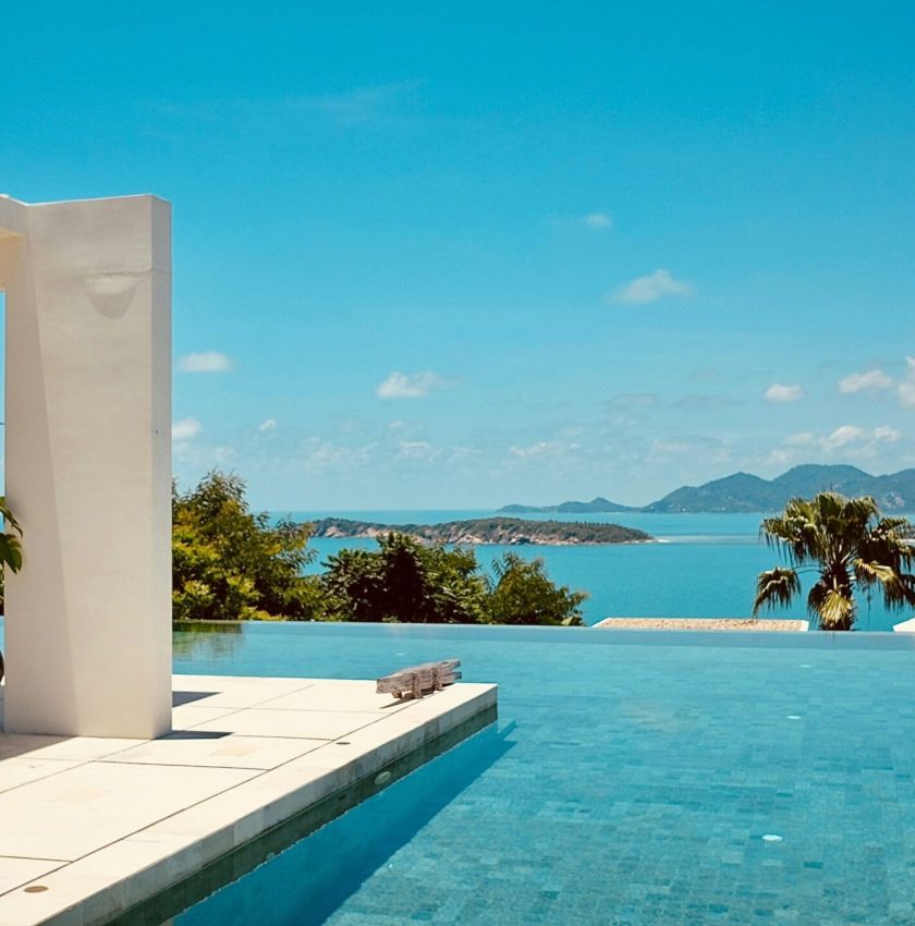 brown wooden house near green trees during daytime