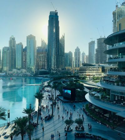 people walking on the street near high rise buildings during daytime